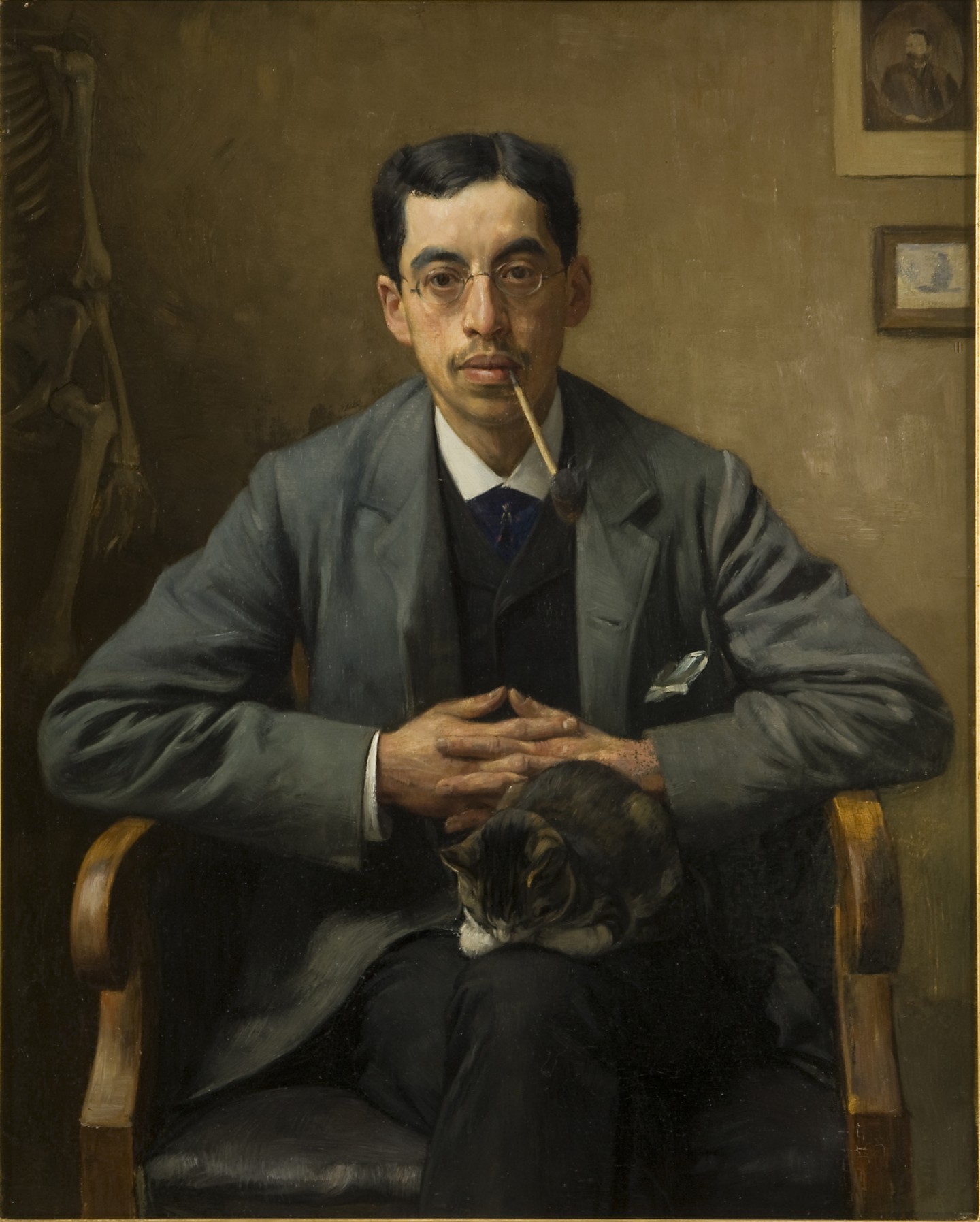 Op de achtergrond van het portret van A. Aletrino is nog een andere schrijver te zien. Wie?